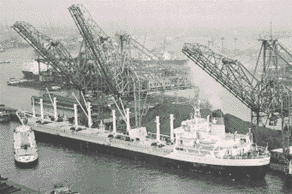 Coal for the Armed Forces being discharged from a MSTS-chartered freighter in Rotterdam