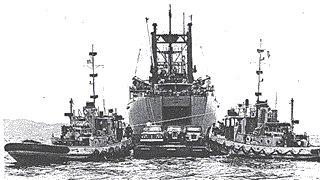 Transferring jeeps and trucks from USNS Comet to a lighter